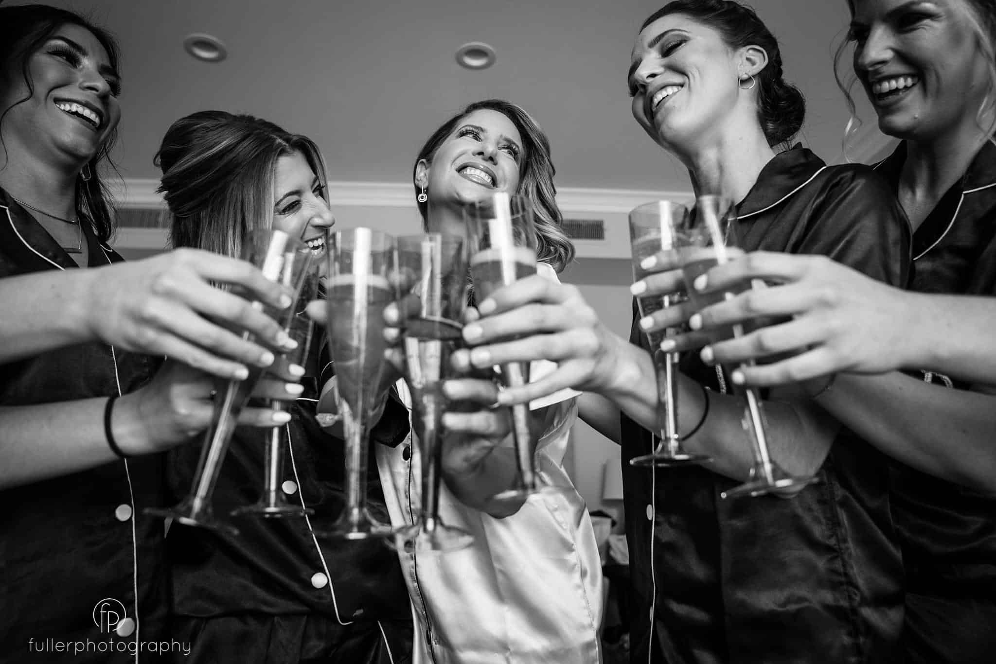 Bridesmaids cheering during their prep