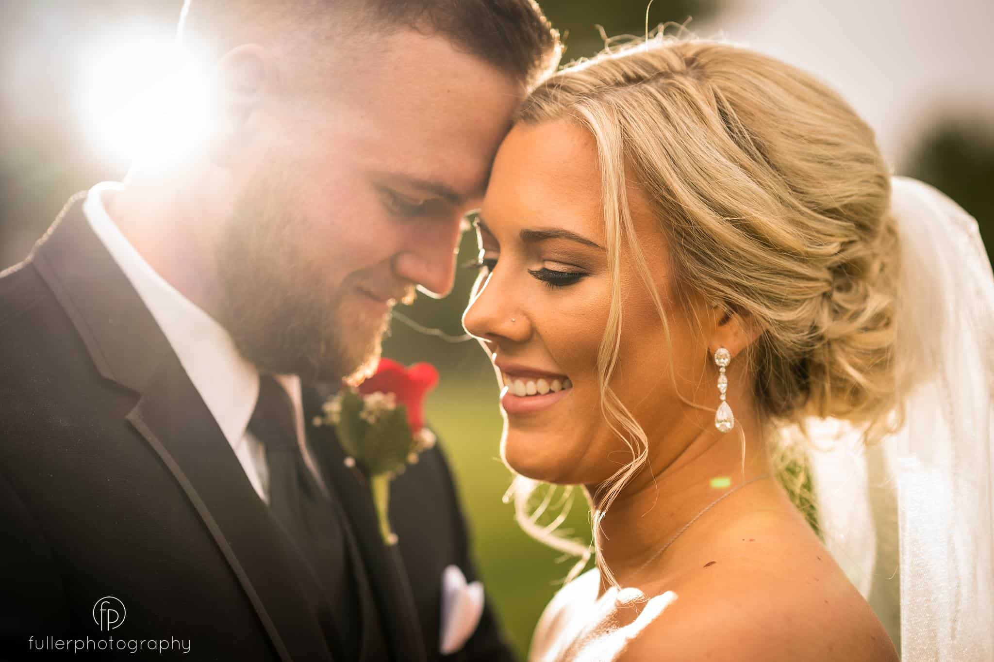 Portrait of the bride and groom outside on the golf course of the Deerfield Country Club
