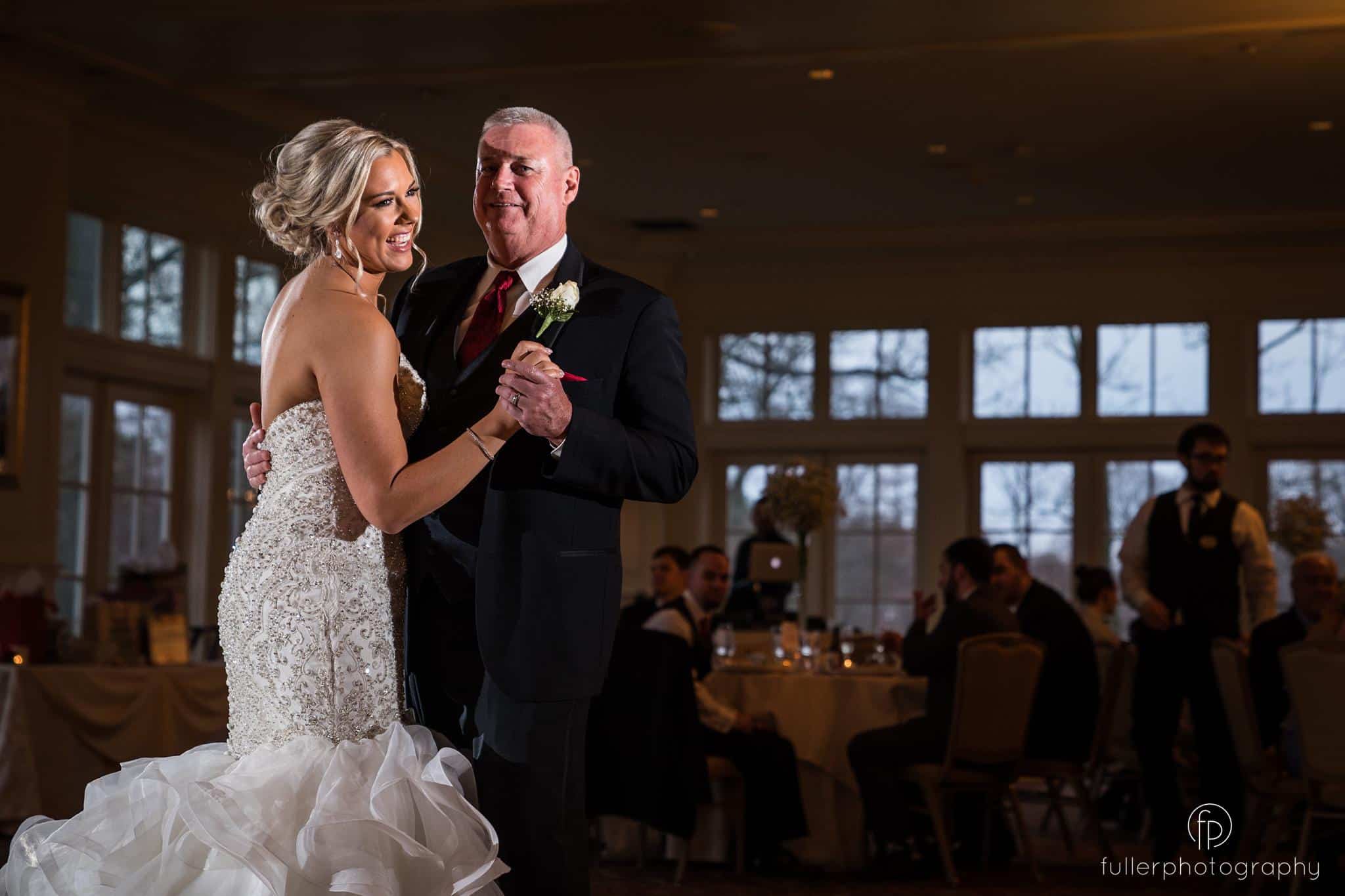 The bride dancing with her father on the ballroom floor of the Deerfield County Club