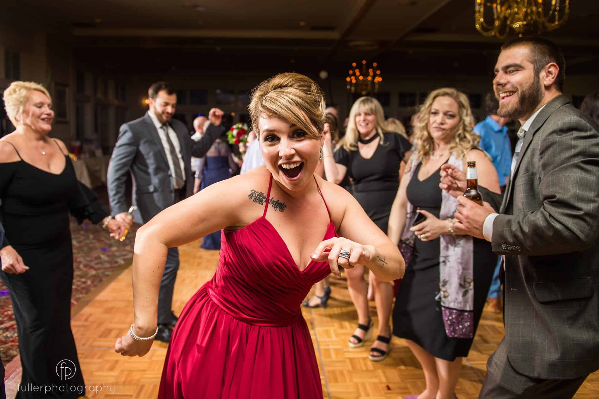 Bridesmaid dancing and laughing