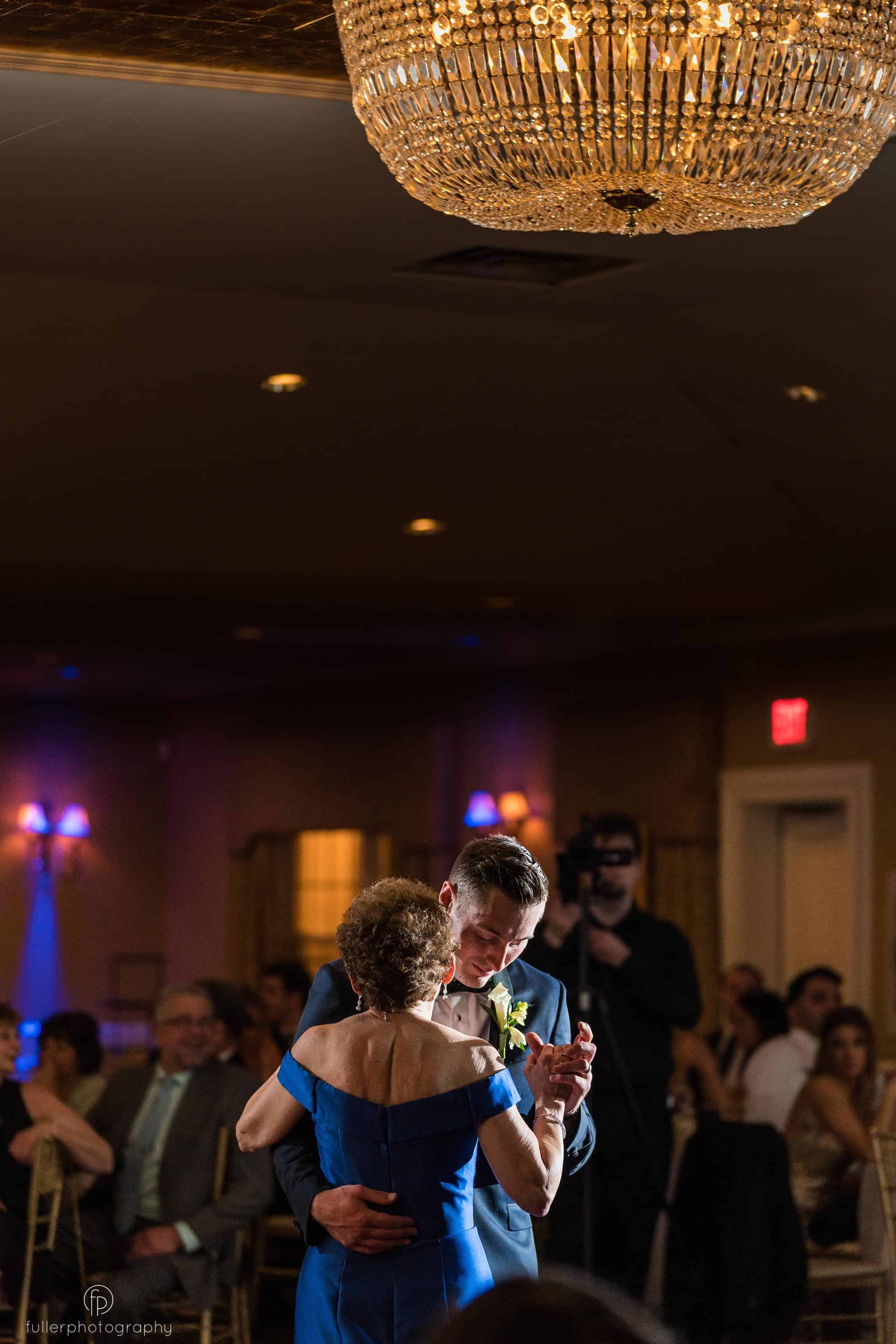 Groom dancing with his mother during their wedding reception
