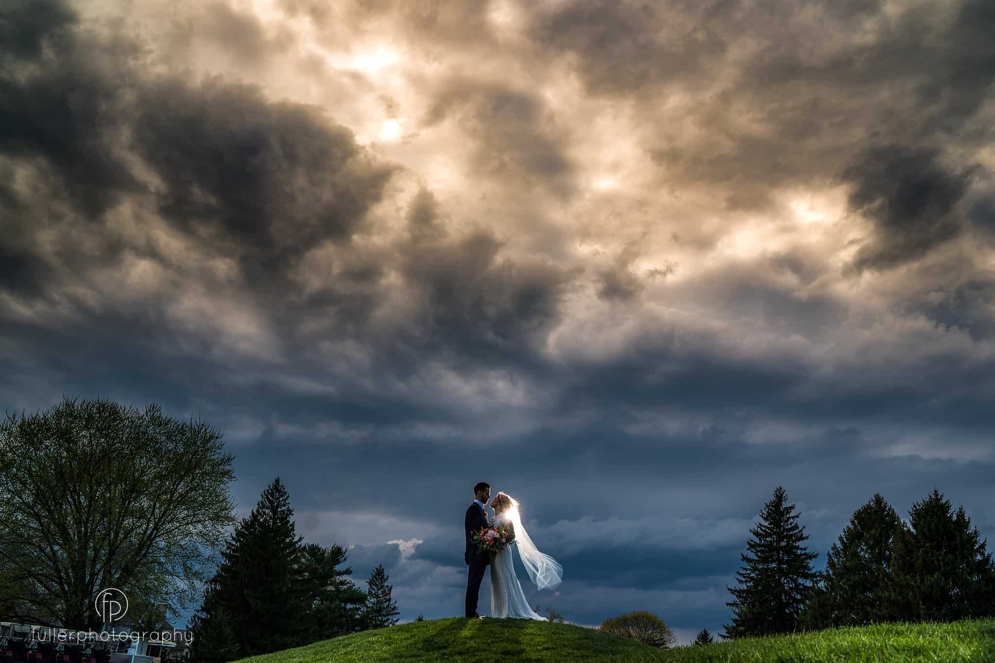 bride and groom at their Penn Oaks wedding right before the storm came.