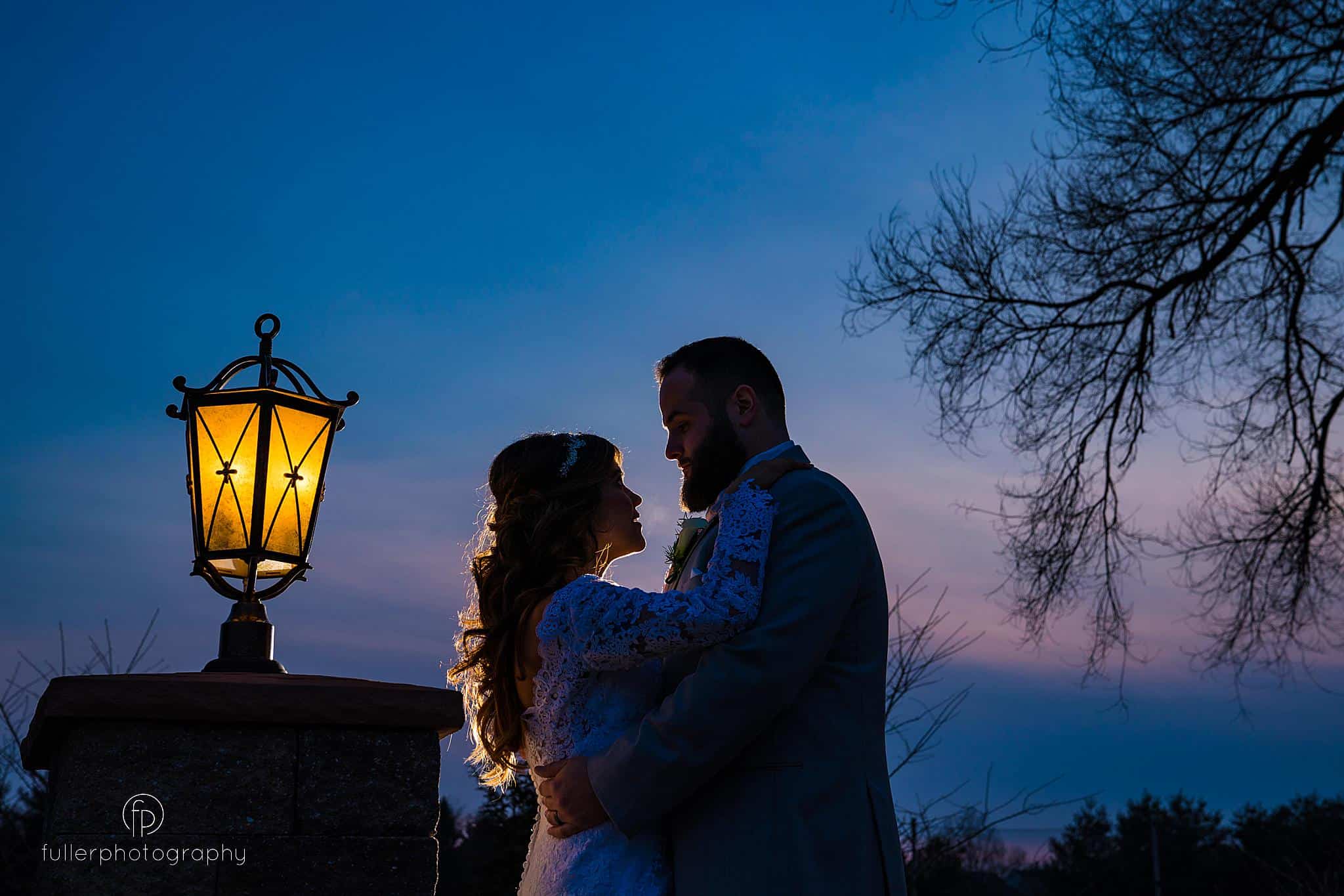 Sunset portrait of the bride and groom outside the Penn Oaks ballroom
