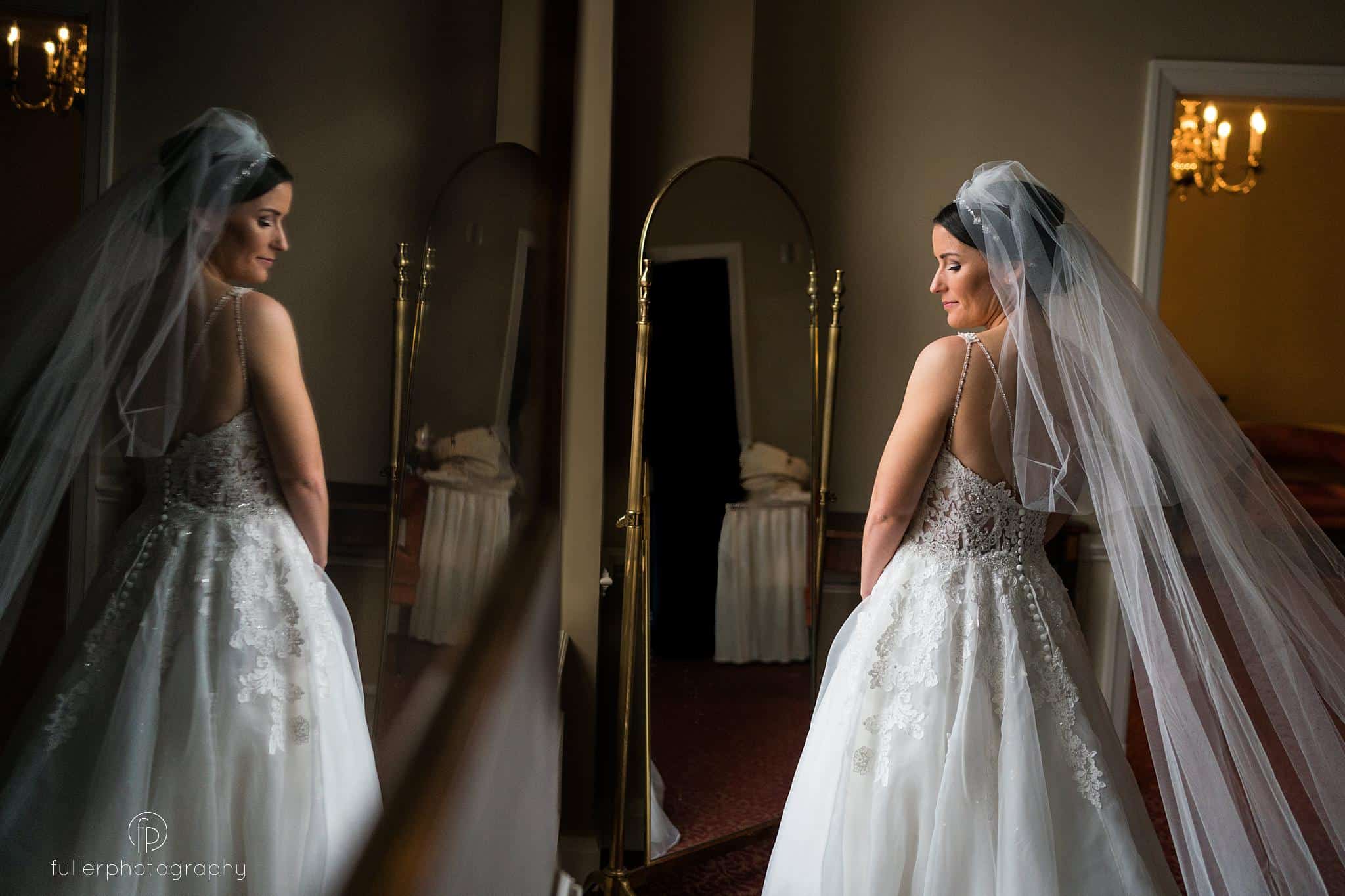 bride looking out the window at Hotel Dupont wedding