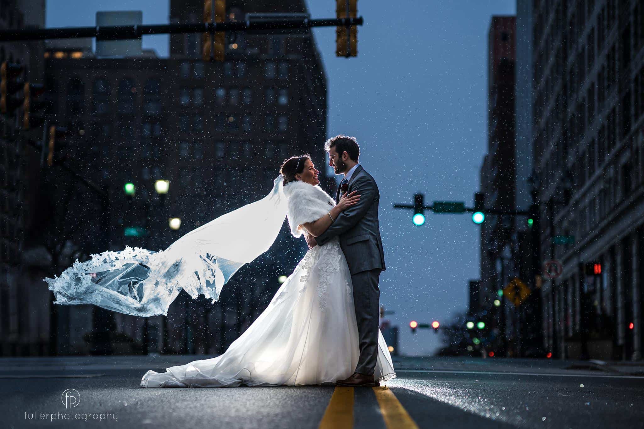Bride and groom portrait outside The Hotel Dupont on the street in Wilmington Delaware