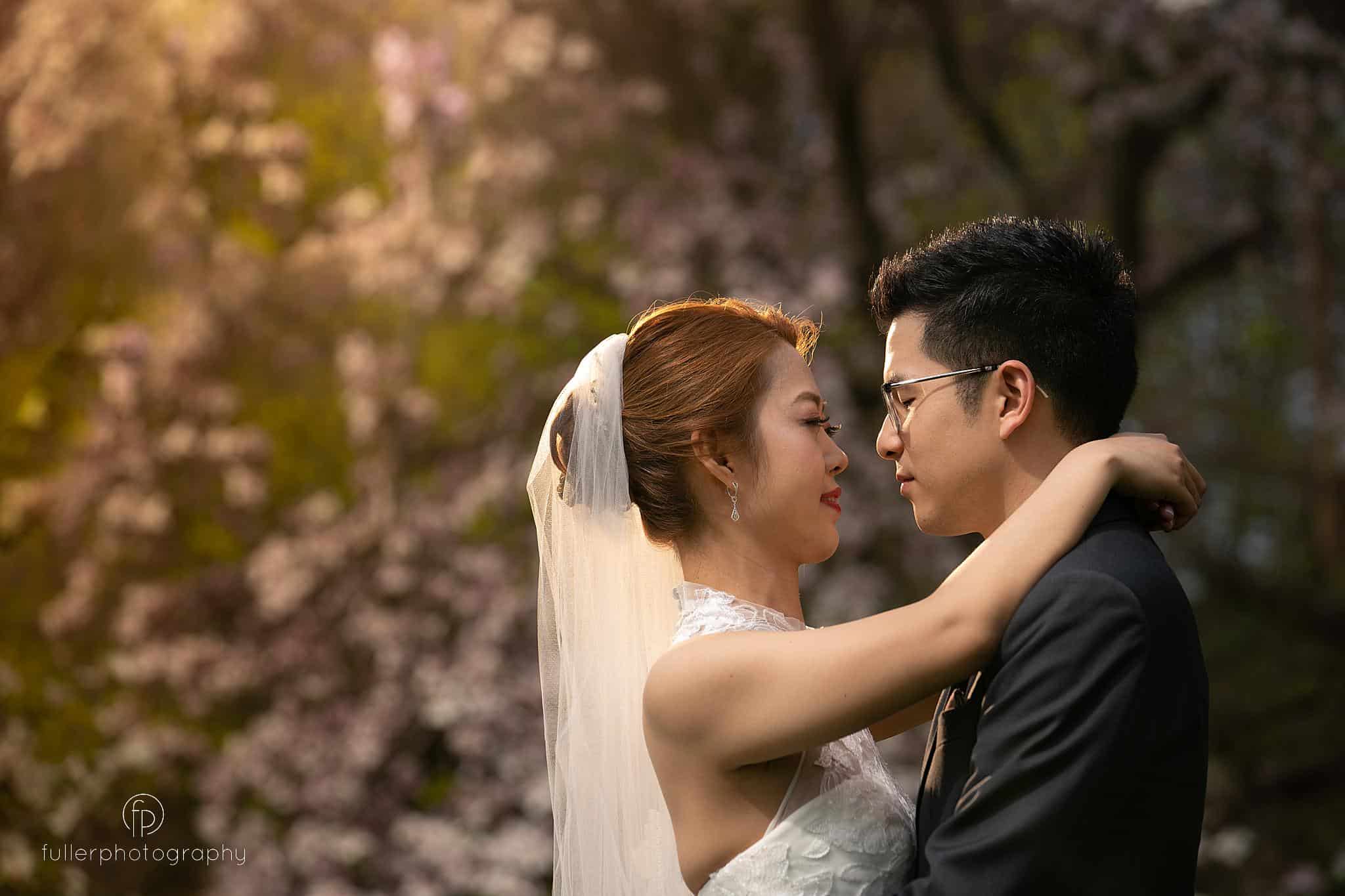 Bride and Groom Portrait in front of blooming tree