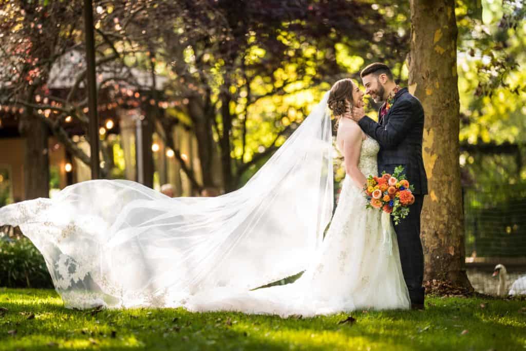 Wedding veil blowing in the wind outside the cocktail hour at a Pomme radnor wedding