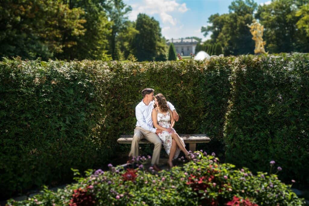 Nemours Estate Photo of engaged couples sitting on the bench.